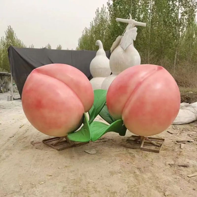 草地桃子雕塑 现代校园果蔬雕塑 大型水果雕塑 草地桃子雕塑 现代校园果蔬雕塑 大型水果雕塑